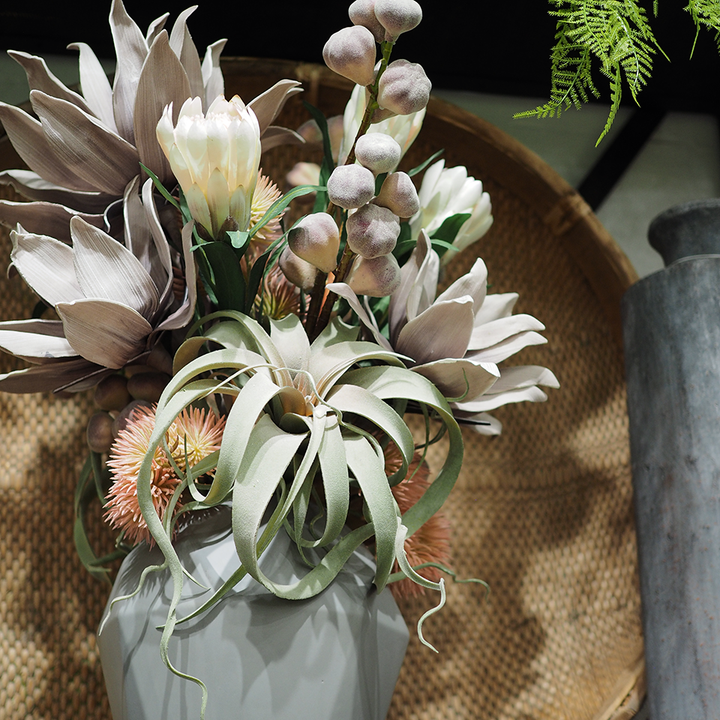 Protea with Tillandsia and Figs in Faceted Ceramic Vase. 31"H