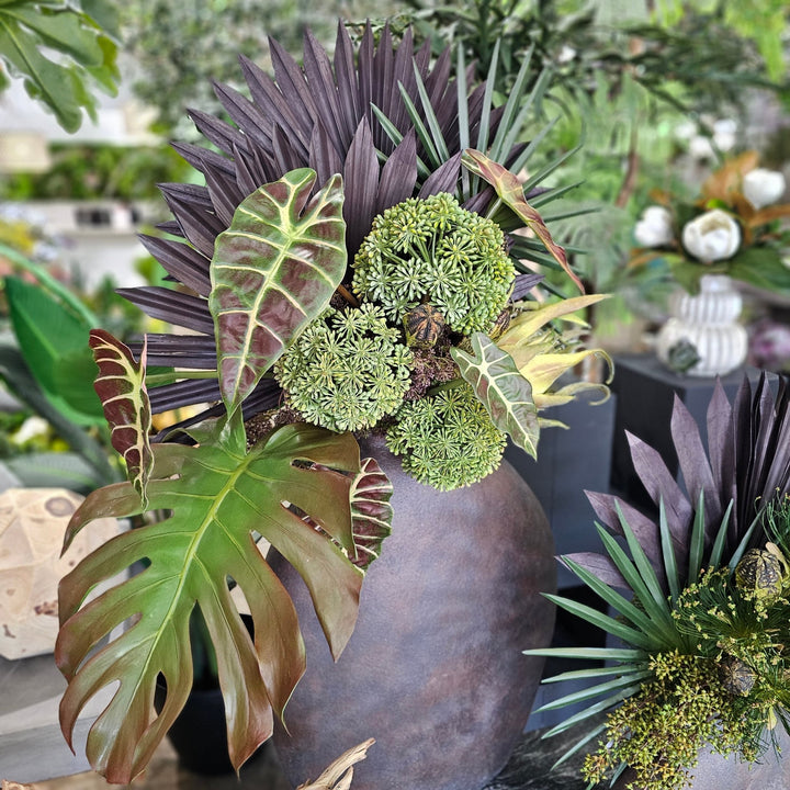 Palms, Tropical Leaves, Protea, Cypress Grass, Sedum, and Mahogany Pods in Aged Vase 41"H - LDF Silk