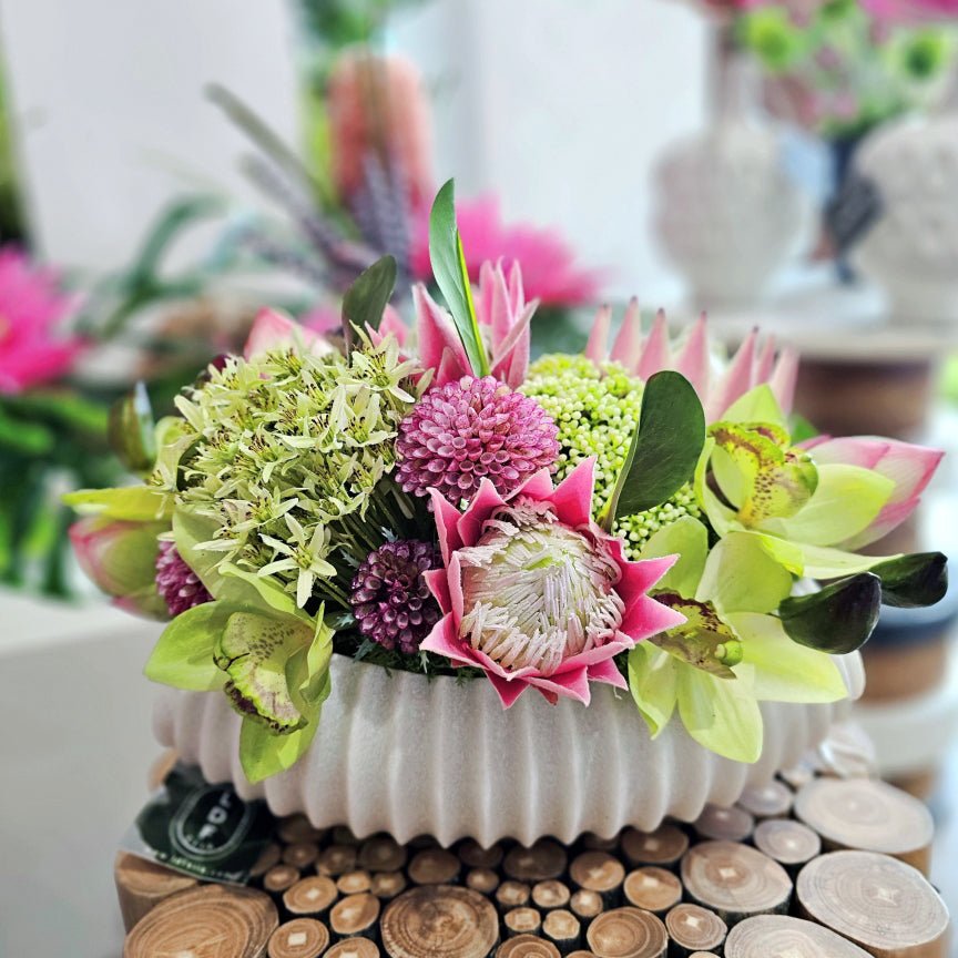 Protea, Lotus Bud, Fennel Seed, Allium, Cymbidium Orchid, and Dahlias in Ribbed Bowl 11"H - LDF Silk