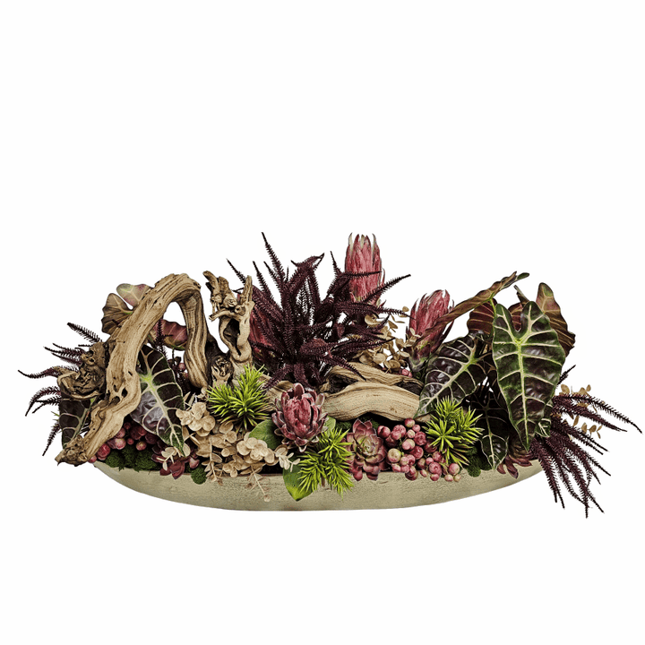 Sculptural Wood with Tropical Leaves, Eucalyptus, Succulents, Berris and Protea in a Oval Metal Boat 20"H x 44"W x 17"D - LDF Silk